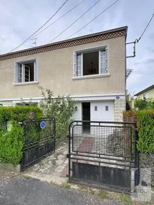 Maison avec garage et jardin - rue très calme
