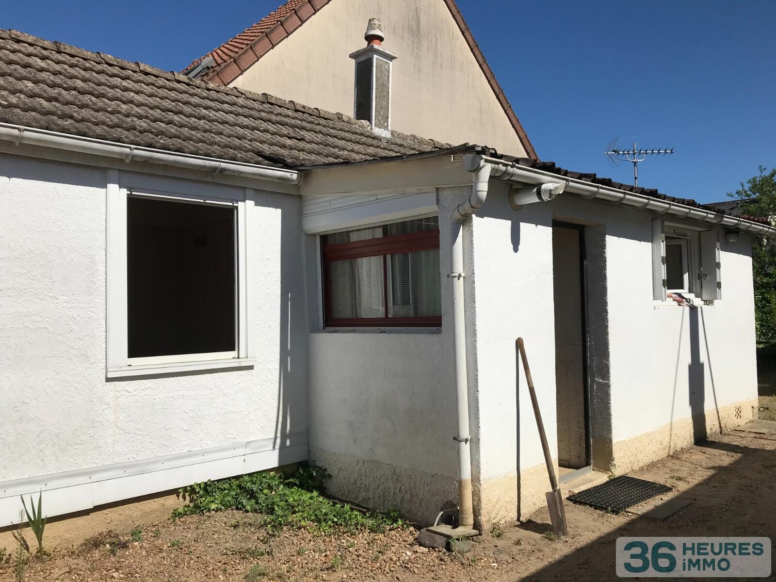 PLAIN-PIED AVEC GARAGE ET TERRAIN