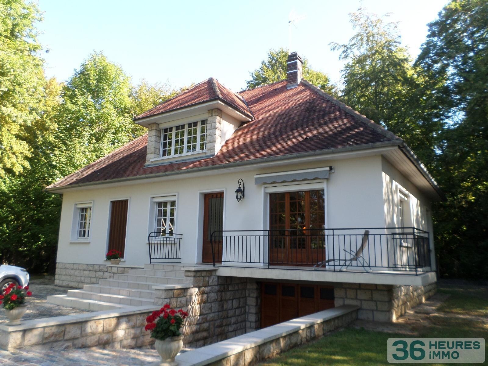 Pavillon style ile de france sur sous-sol avec partie de terrain constructible