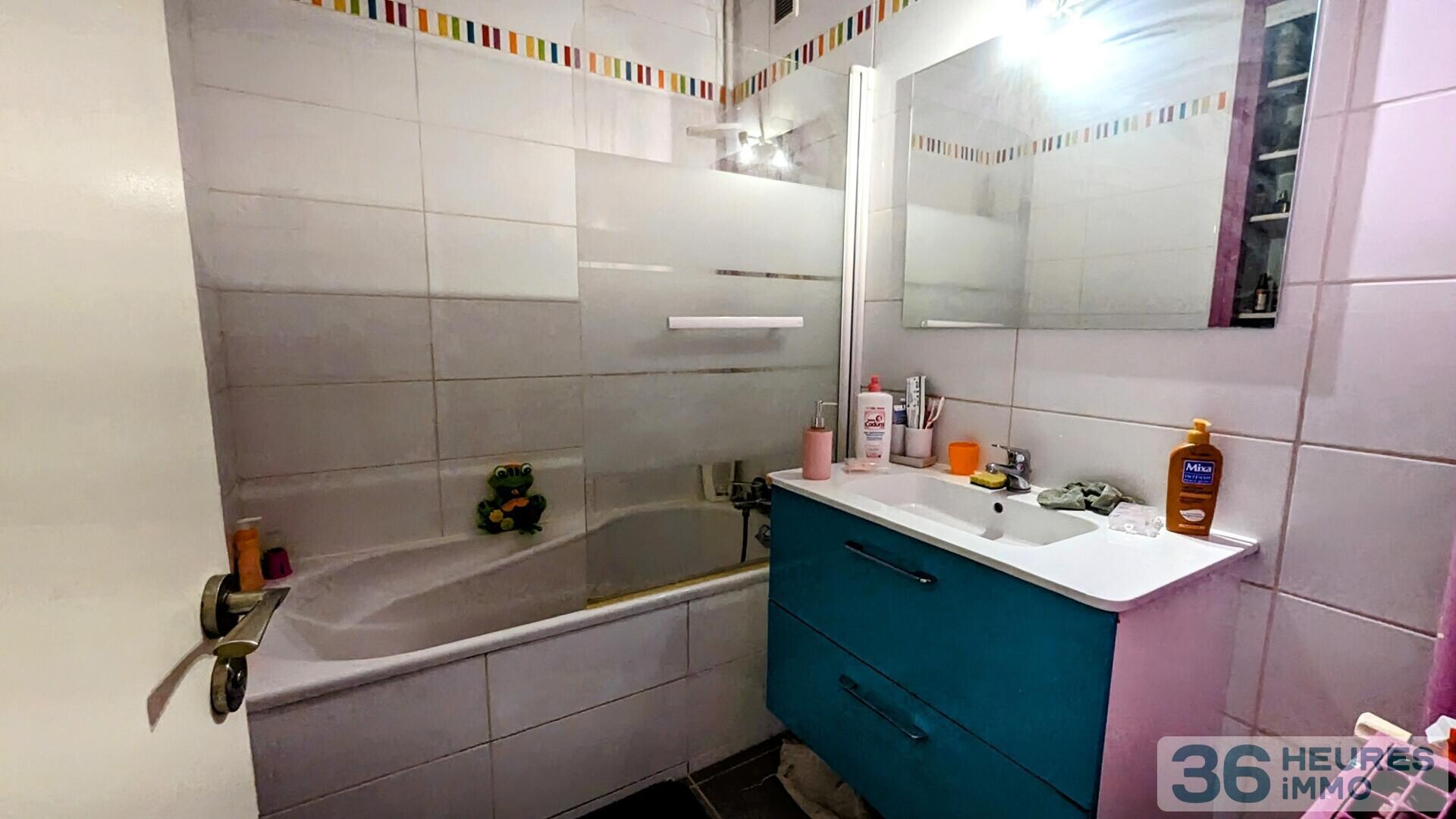 Appartement de pratiquement 90m² avec balcon, buanderie et cave