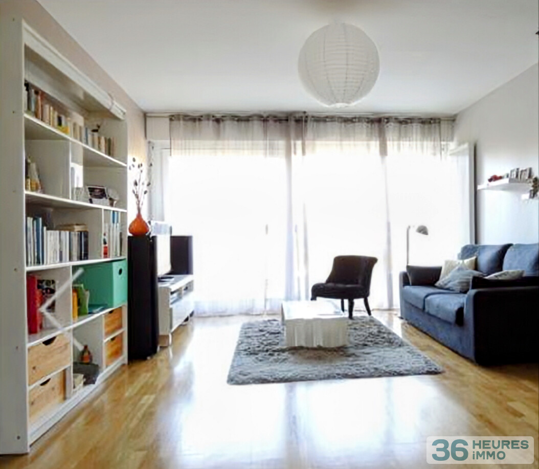 Appartement de pratiquement 90m² avec balcon, buanderie et cave