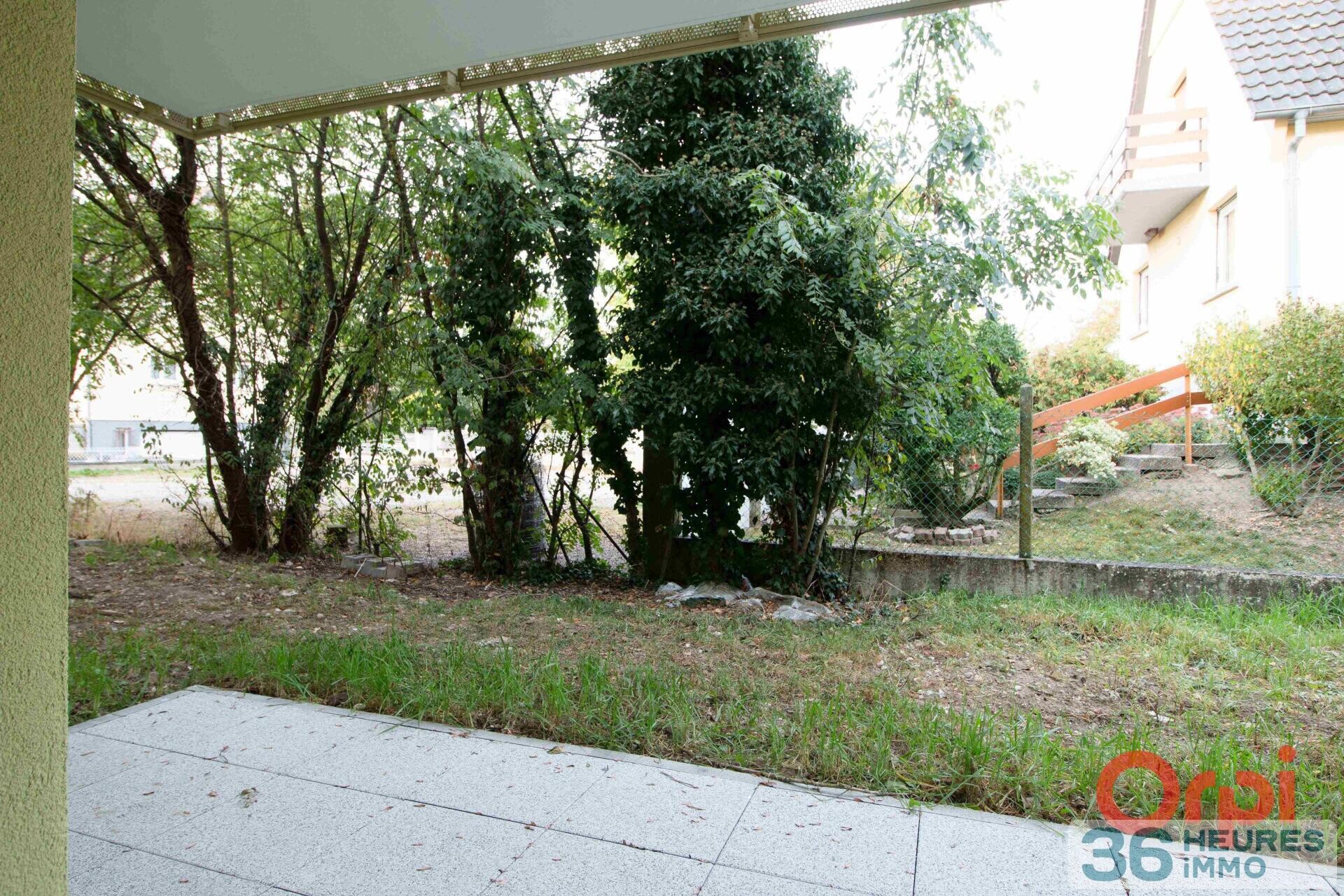  Appartement rez-de-jardin avec cave + parking