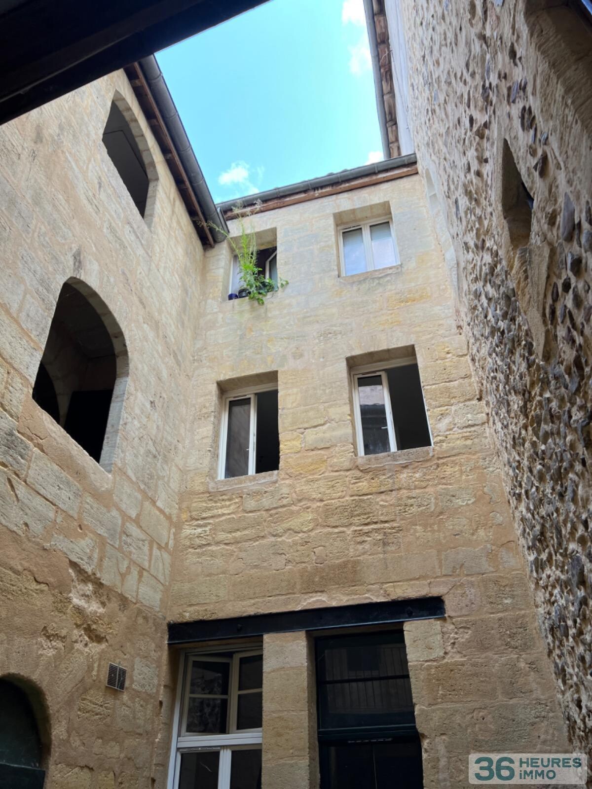 IMMEUBLE 5 APPARTEMENTS + 1 GARAGE+ CAVES 