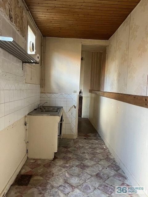 MAISON DE VILLE EN PIERRE AVEC JARDIN